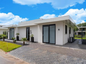 Villa with covered terrace and jetty on the water